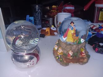 Two musical snow globe