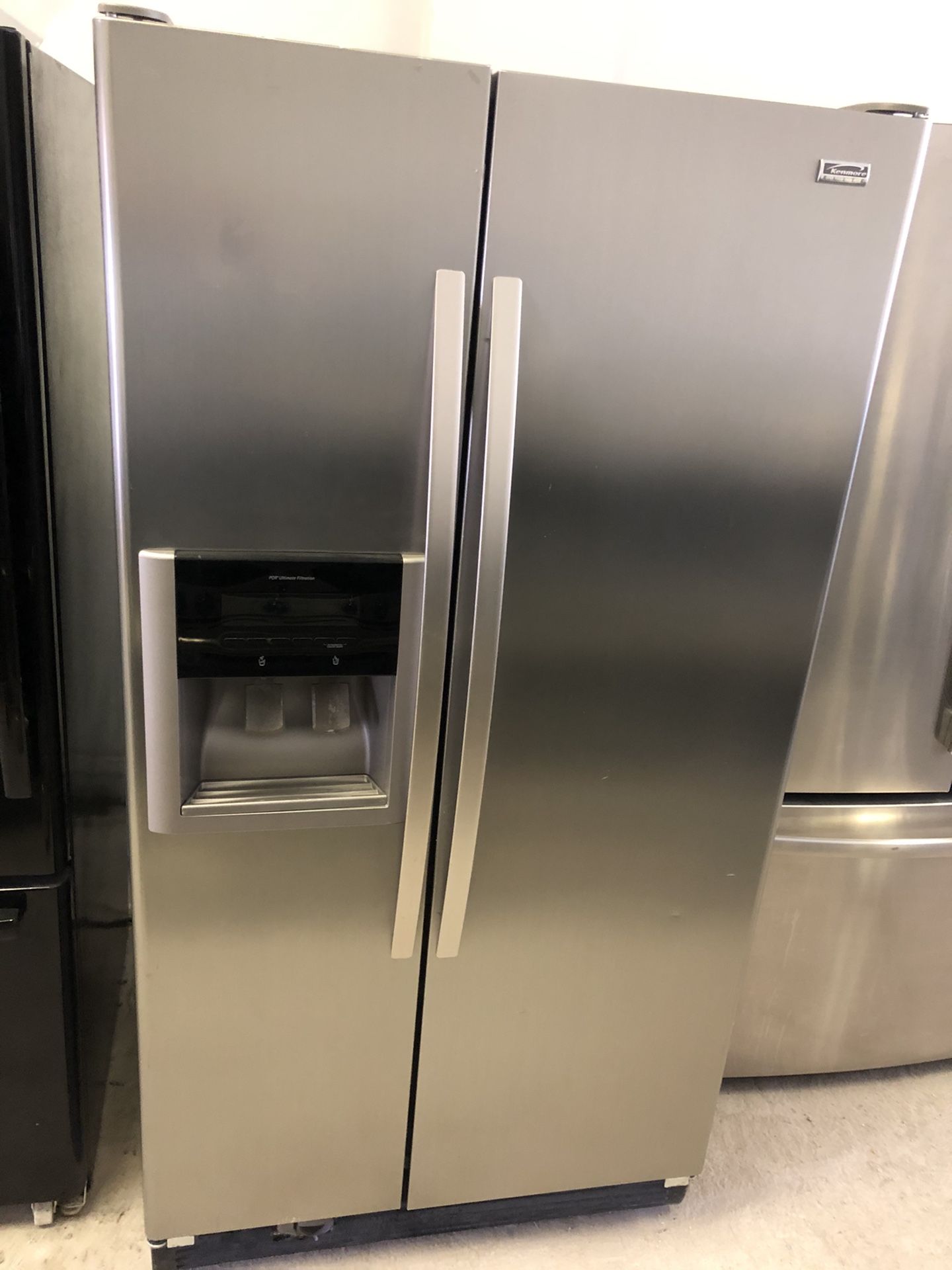 Kenmore Elite side x side stainless steel refrigerator & GE 5 burner stainless steel gas stove set