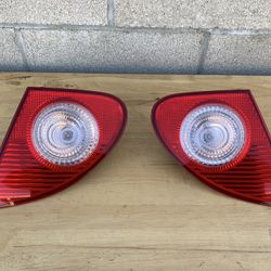 2003-2008 TOYOTA COROLLA INNER TAIL LIGHTS TRUNK MOUNTED INNERS OEM