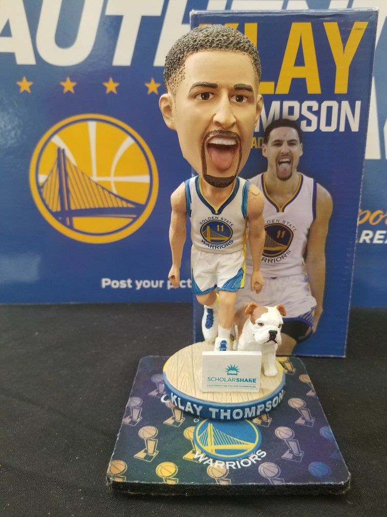 Klay Thompson with Rocco bobblehead