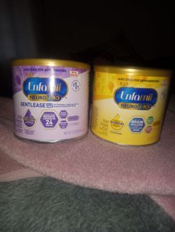 Two brand new cans of enfamil
