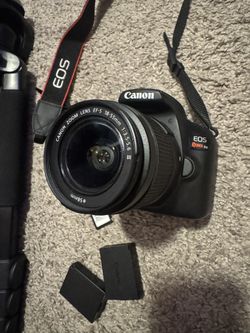 Canon EOS Rebel t6 with two batteries and tripod
