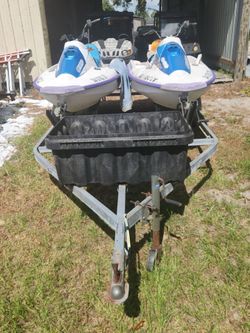 4 jetskis and 2 jetski trailer