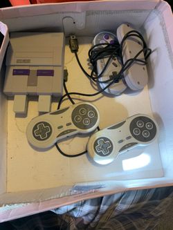 Classic snes console with two remotes and two wireless remotes