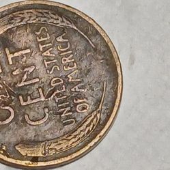 Nineteen forty six , no matt mark wheat penny red with l touching the rim