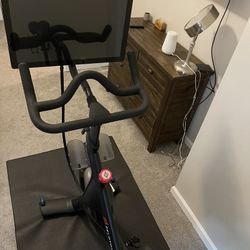 Peloton Bike - Barely Used + Mat & Size 9 Cycling Shoes 