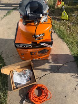 RIDGID 6 Gal. 150 PSI Portable Electric Oil-Free Jobsite Pancake Air Compressor with 25 ft. Air Hose and 18GA Brad Nailer