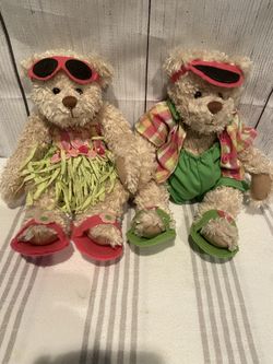 Never used kept in plastic nice quality Hawaiian style Terry’s Village collectible Teddy Bear set reduced to $25 for both!