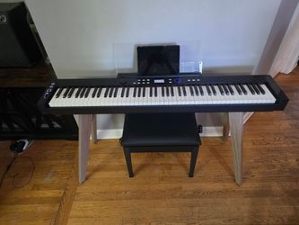 Casio PX-S7000 Digital Piano - Black with bench.