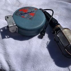 Vintage Cordomatic model 500 retractable trouble shop light, a popular mid-century garage and workshop tool. 