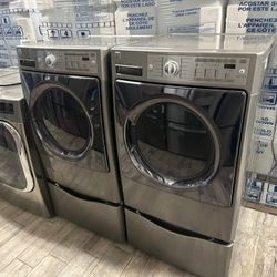 Kenmore elite stainless steel Frontload washer and dryer set electric used