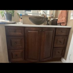 2 Like new beautiful dark oak bathroom vanities $500 Each ($950For Both)