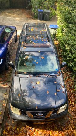 Nissan SUV Black with Roof Rails