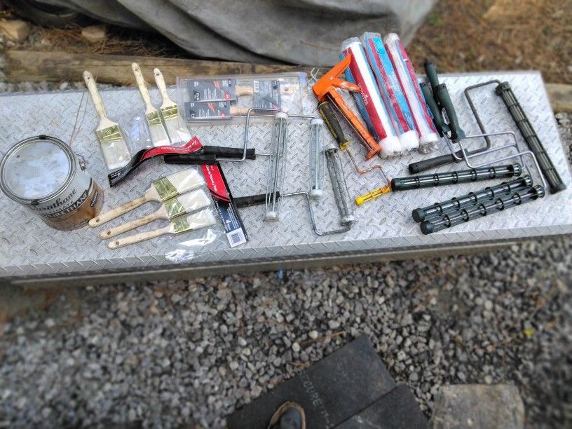 Large Supply Of Painting Material And A Tile Cutter
