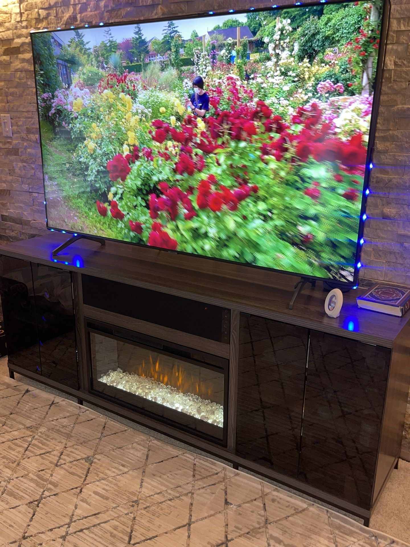 Large TV stand with fireplace and strong speakers