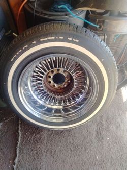 One 14-in wire wheels laces roadster something
