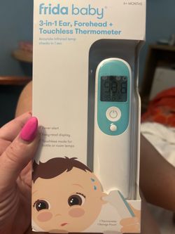 Frida Baby 3-in-1 Thermometer, which features a blue and white design used for forehead, ear, or touchless reading