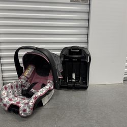 Evenflo Nurture Infant Car Seat with its stay-in-car base