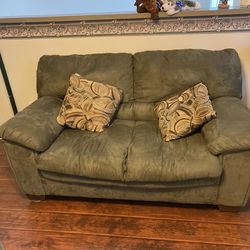 Used Love Seat With Two Pillows