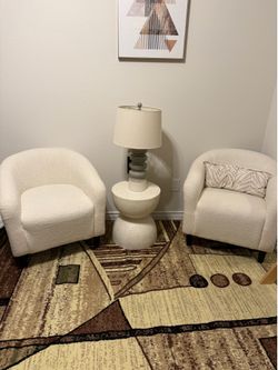 Two boucle lounge chairs