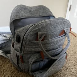 Diaper bag backpack with changing station 