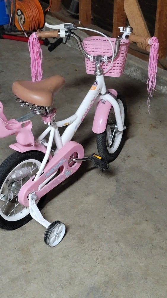 Little Girls , Beginners Bikes Like New . Has Baby Doll Seat Attachment 40 Each