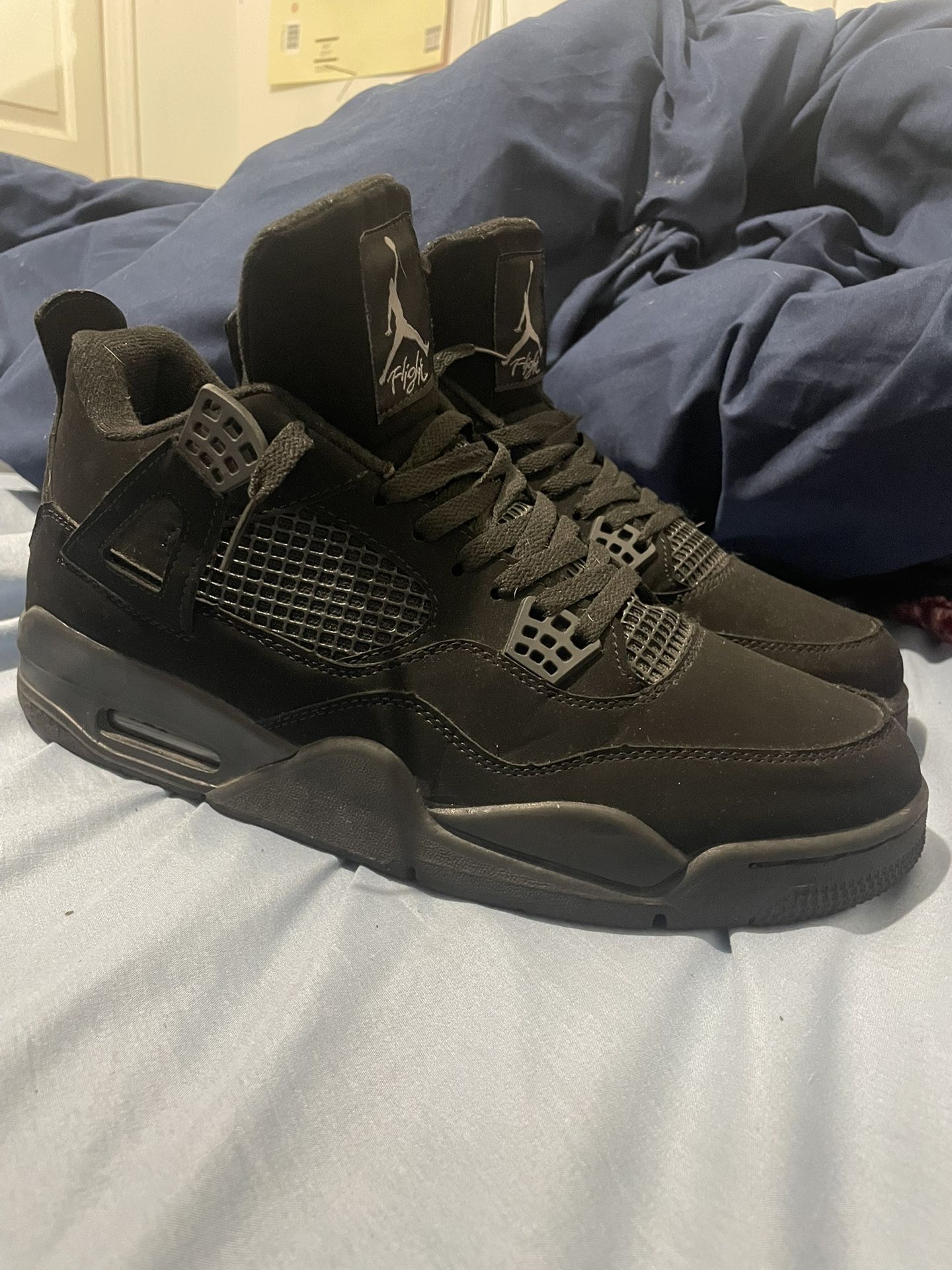 Black Cat Jordan 4s 