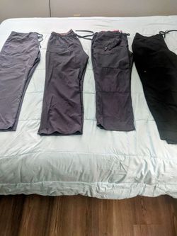 Like new, barely used scrubs in sizes L and XL ,  6  Scrub Tops, 4 Scrub Bottoms , 6  Scrub  Sets
