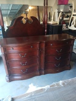 Ashley furniture "Bombe Chest"of drawers in Brown Cherry Stain Finish