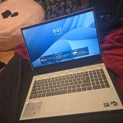 Dell gaming laptop with fan attachment for the bottom and carrying bag