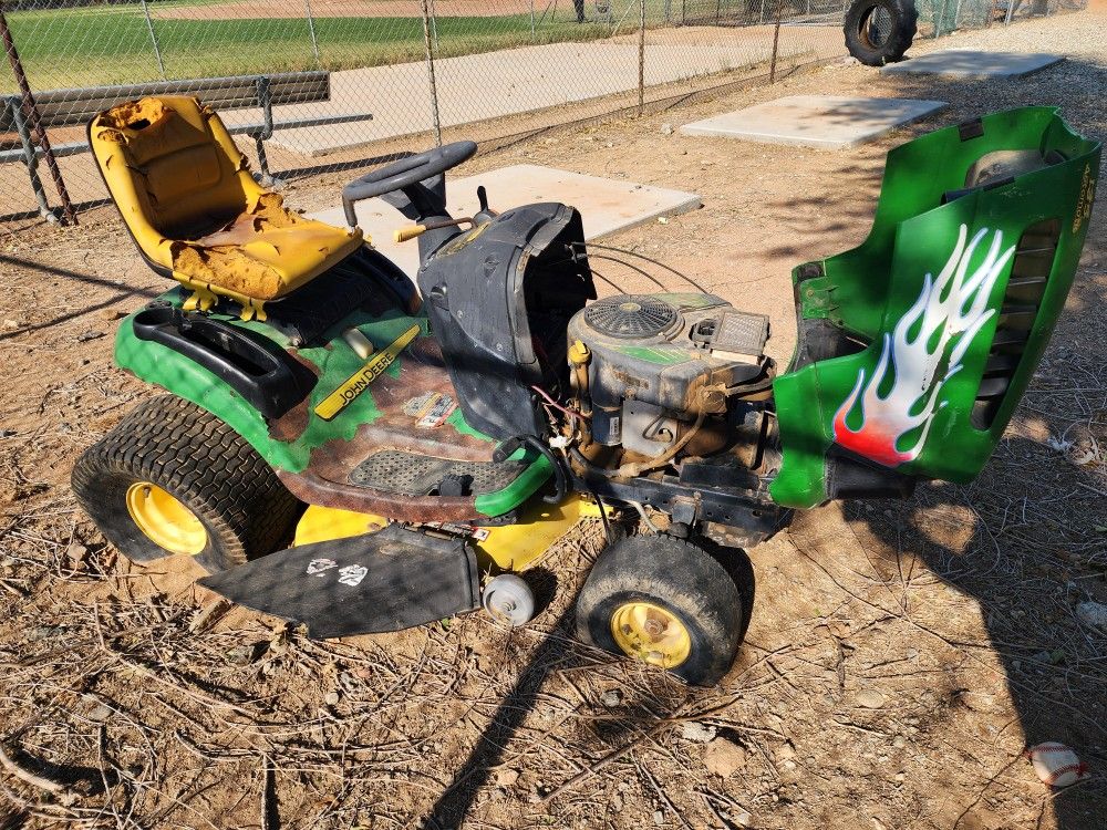 John Deere L118 riding lawn mower.