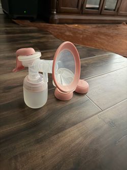 Manual pump/colostrum collector