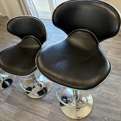 4 black adjustable height bar stools