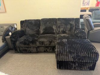 Sectional with recliner and storage