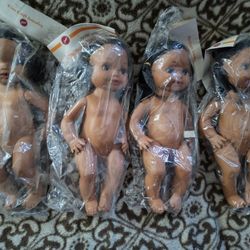 4 Baby Dolls In Packaging