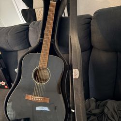 Black Fender acoustic guitar