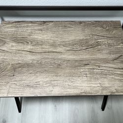 - Laminate wood finish foldable desk.