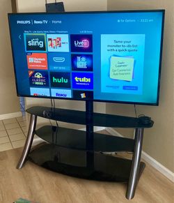65” Roku Smart TV with Glass & Metal Television Stand Original box
