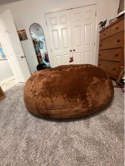 Xtra large brown memory foam bean bag. Medium size Red memory foam bean bag