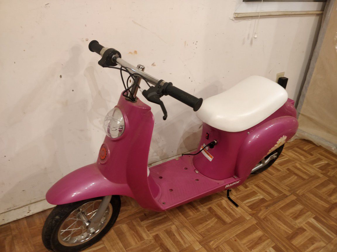Nice Blossom electric scooter with charge and storage under seat in good condition