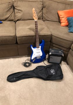 SX guitar great condition comes with amplifier guitar all cords necessary and a runner case
