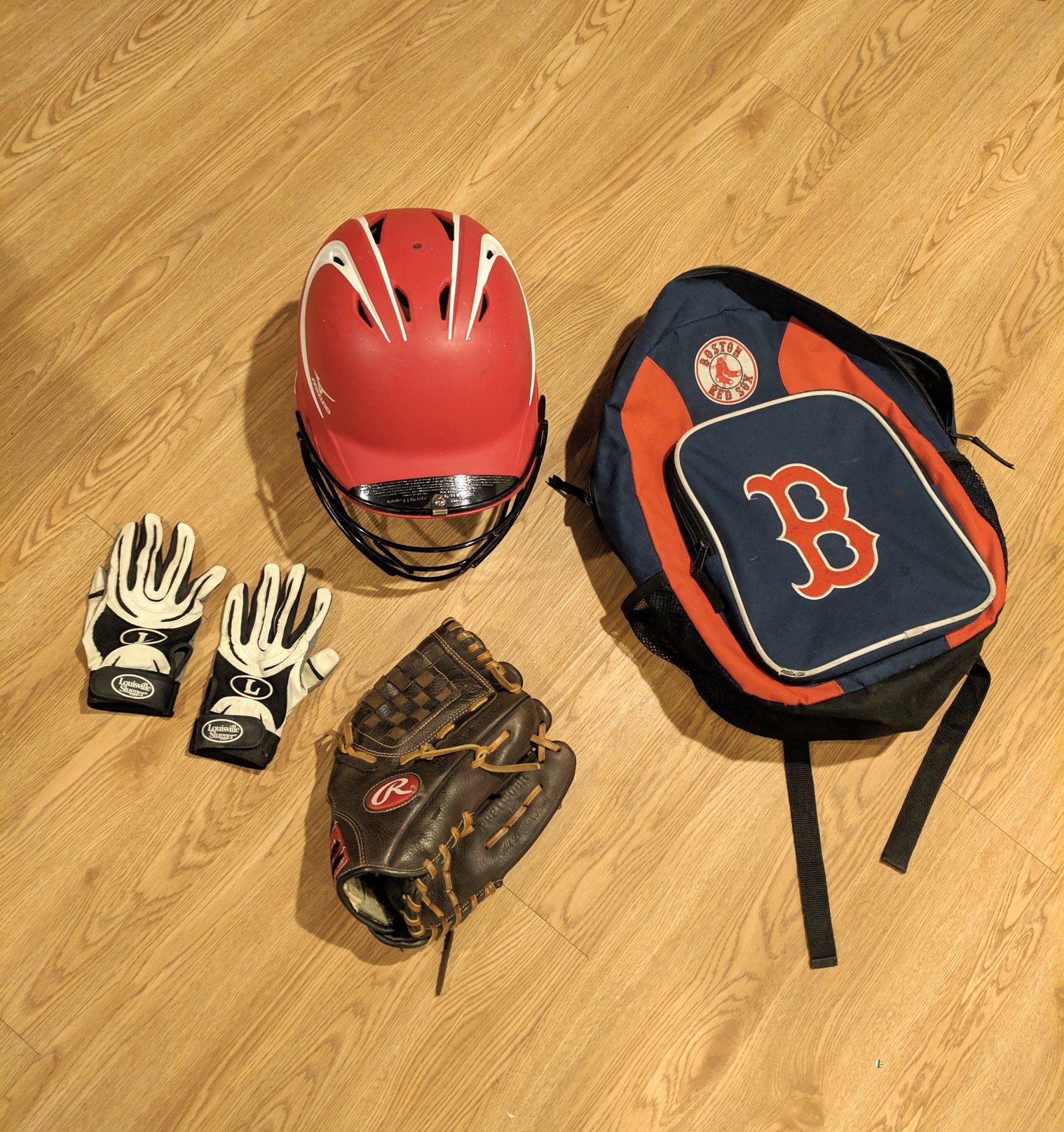 Baseball gear. Mizuno batters helmet with cage. Rawlings glove. Two batting gloves. Free red sox bag.