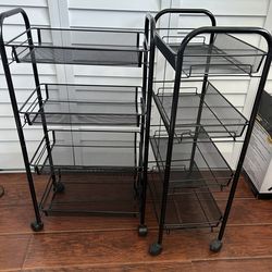 Two black metal 4-tier rolling carts