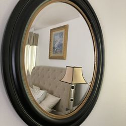 Oval black  painted Mirror with gold trim