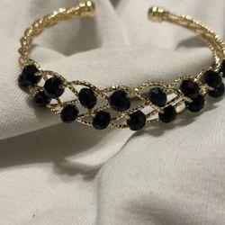 It's a gold-tone cuff 