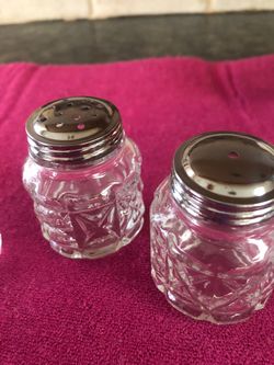 Vintage glass salt and pepper shakers, plus jam jar with spoon. 2 1/2 inches tall