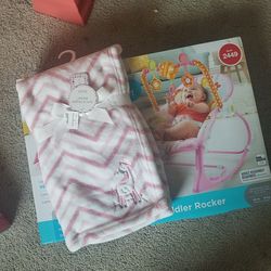 Baby bouncer and blanket .