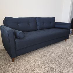 Like New- 76" Mid-Century Modern Tufted Navy Blue Sofa with 2 Bolster Pillows and Tan Legs