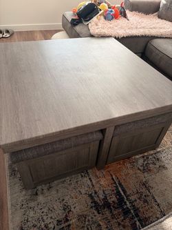 Table with four storage stools