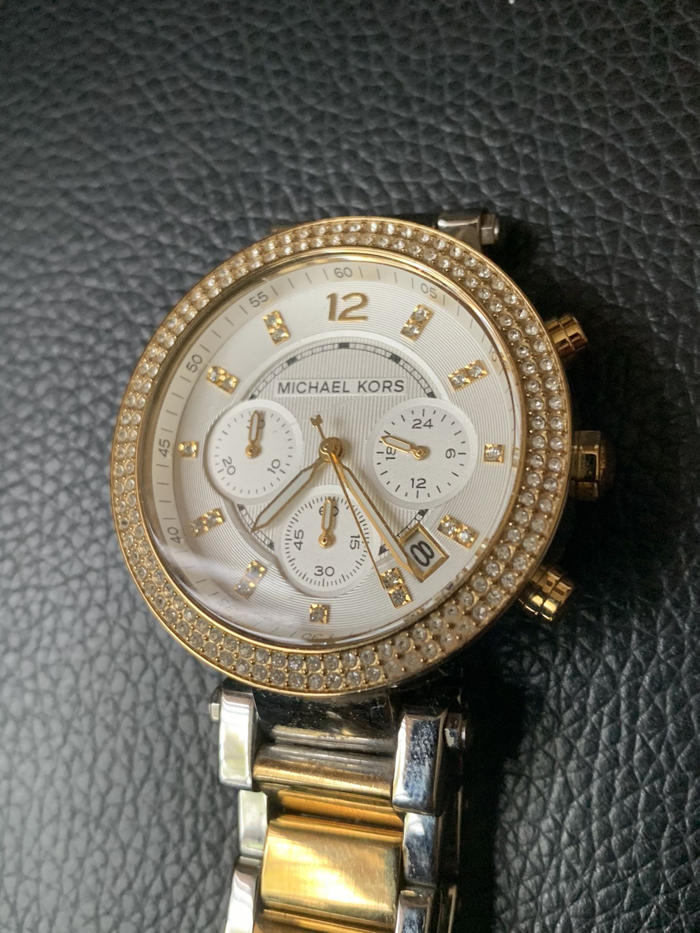 Women’s Michael Kors watch with diamonds.